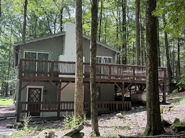 1827 Stag Run, Pocono Lake, PA 18347 - back of house featuring a deck and a chimney