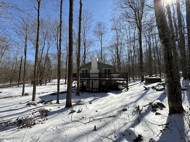 1827 Stag Run, Pocono Lake, PA 18347 - view of snow covered exterior featuring a wooden deck