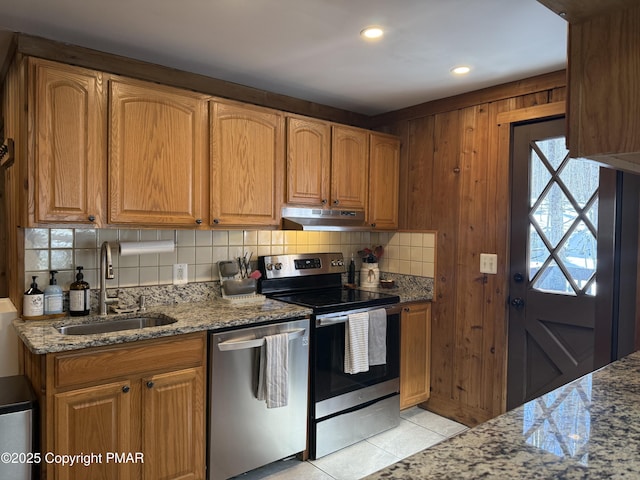 1827 Stag Run, Pocono Lake, PA 18347 - kitchen featuring a sink, under cabinet range hood, backsplash, stainless steel appliances, and light stone countertops
