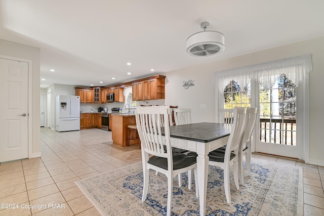 dining area featuring recessed lighting and light tile patterned floors