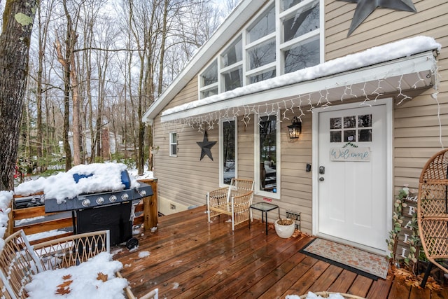 view of snow covered deck