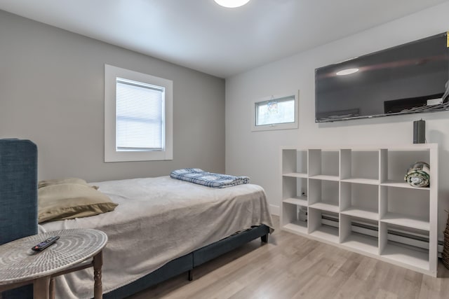 bedroom featuring wood finished floors