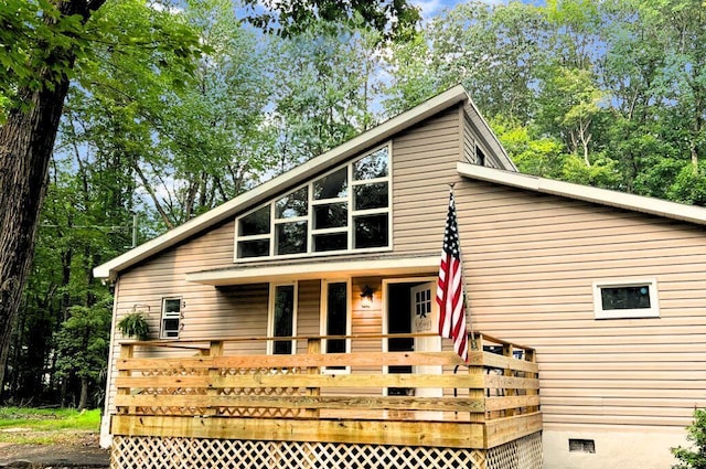 view of front of property with crawl space and a deck