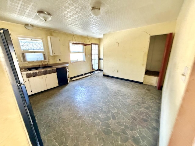 190 Carverton Rd, Trucksville, PA 18708 - kitchen featuring baseboards, white cabinets, a sink, and a textured ceiling