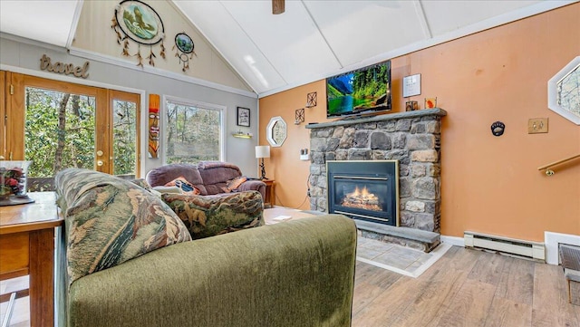 living area featuring wood finished floors, a fireplace, baseboards, high vaulted ceiling, and a baseboard heating unit