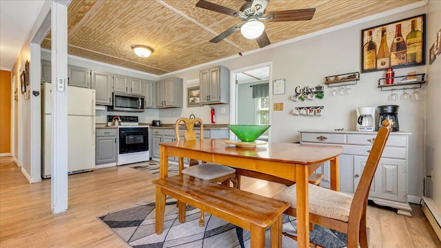 kitchen featuring ornamental molding, electric range, ceiling fan, stainless steel microwave, and gray cabinetry