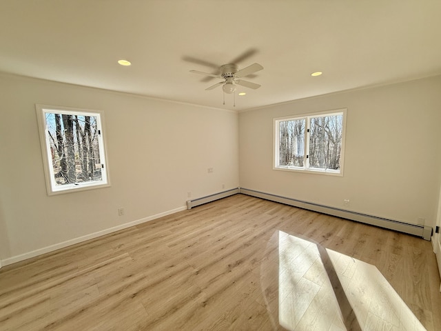 unfurnished bedroom with baseboards, ceiling fan, light wood-style flooring, baseboard heating, and recessed lighting