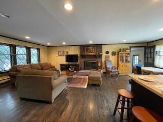 living area with recessed lighting and dark wood finished floors