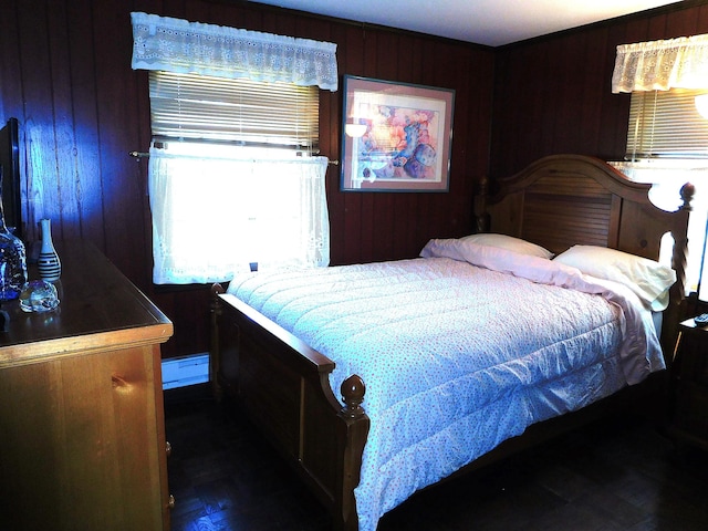 bedroom featuring wooden walls
