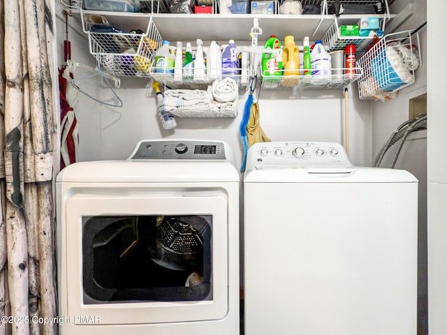 washroom featuring washer and dryer and laundry area