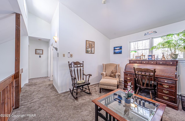 living area with carpet flooring and lofted ceiling