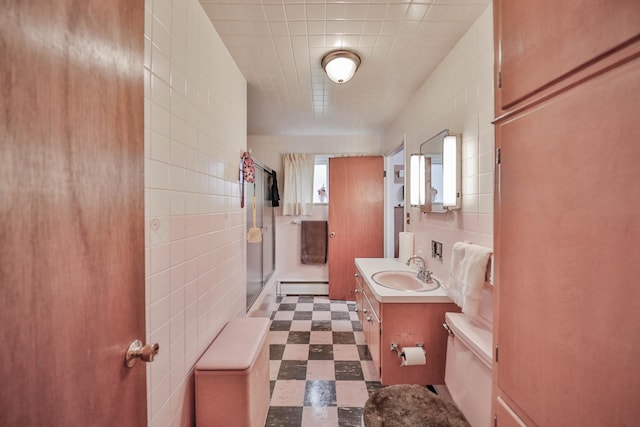 60 Maple Dr, Palmerton, PA 18071 - full bathroom with tile patterned floors, a shower stall, vanity, tile walls, and baseboard heating