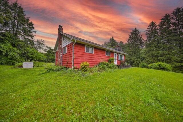 60 Maple Dr, Palmerton, PA 18071 - property exterior at dusk featuring a chimney
