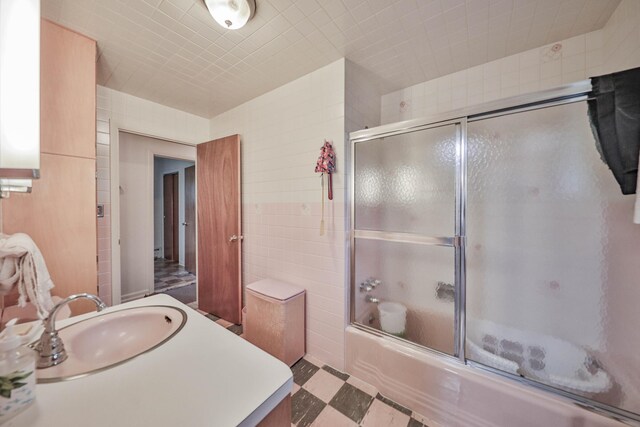 60 Maple Dr, Palmerton, PA 18071 - full bathroom with tile patterned floors, vanity, shower / bath combination with glass door, and tile walls