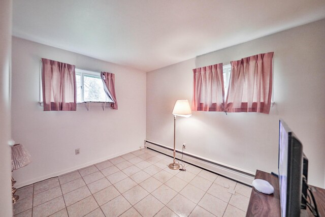 60 Maple Dr, Palmerton, PA 18071 - unfurnished room with a baseboard heating unit and light tile patterned flooring