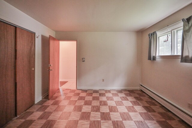 60 Maple Dr, Palmerton, PA 18071 - unfurnished bedroom featuring a baseboard heating unit and a closet