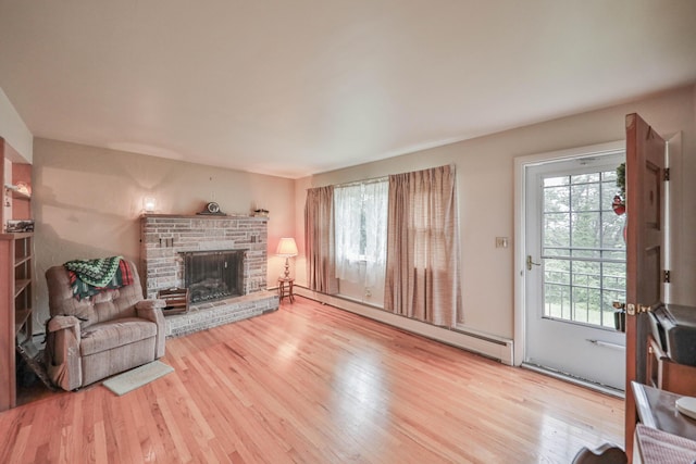 60 Maple Dr, Palmerton, PA 18071 - living room with wood finished floors, plenty of natural light, and a baseboard heating unit