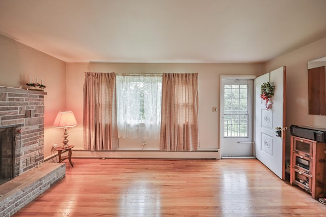 60 Maple Dr, Palmerton, PA 18071 - unfurnished living room with a stone fireplace and wood finished floors