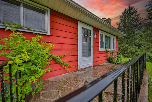 60 Maple Dr, Palmerton, PA 18071 - exterior entry at dusk with a chimney