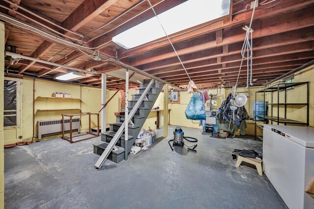 60 Maple Dr, Palmerton, PA 18071 - unfinished below grade area featuring radiator, fridge, and stairway
