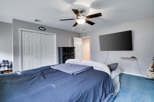 bedroom with visible vents, carpet floors, a closet, baseboards, and a ceiling fan