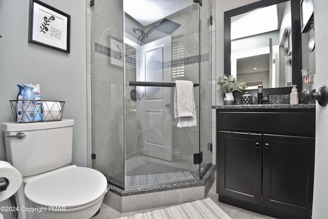 full bath with toilet, a stall shower, and vanity