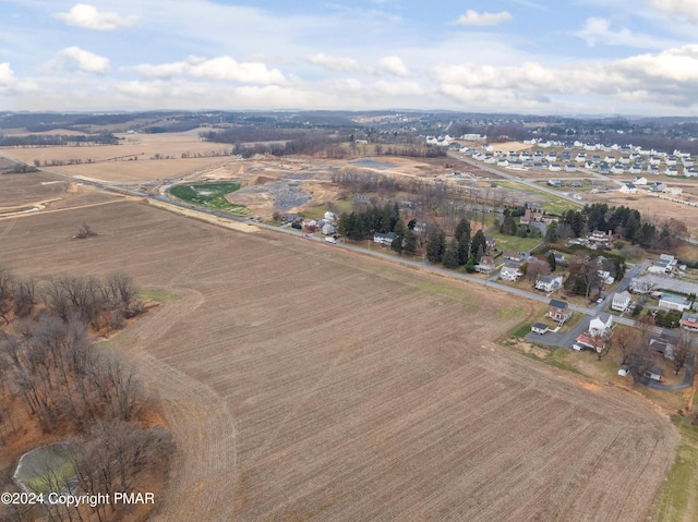 birds eye view of property featuring a rural view