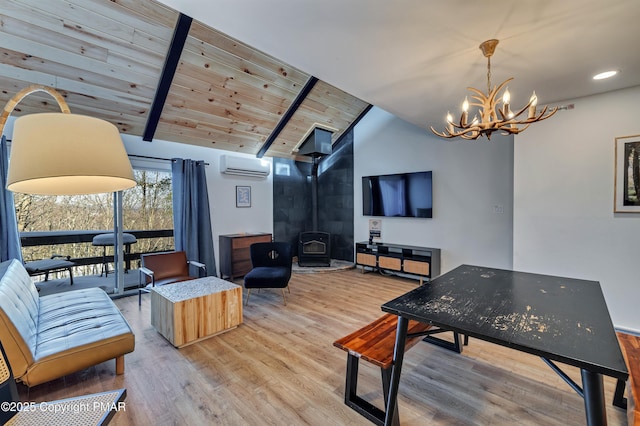 interior space with vaulted ceiling with beams, wood ceiling, a wood stove, wood finished floors, and a wall mounted air conditioner