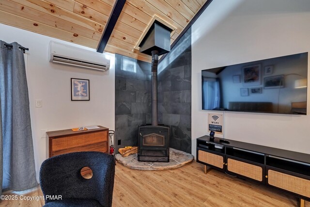 living room featuring wood ceiling, wood-type flooring, lofted ceiling with beams, a wood stove, and a wall unit AC