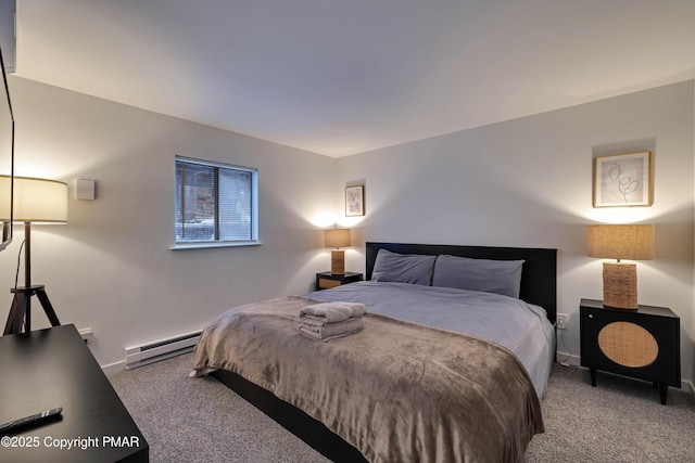 carpeted bedroom with a baseboard heating unit and baseboards