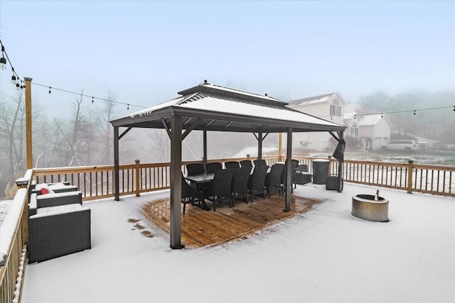 snow covered deck with a gazebo