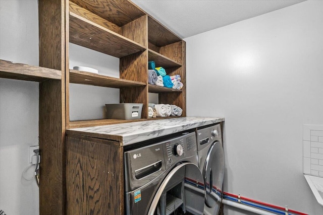 laundry area with laundry area and washing machine and clothes dryer