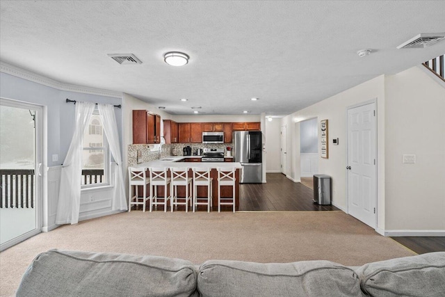 living room featuring visible vents, baseboards, and dark wood finished floors