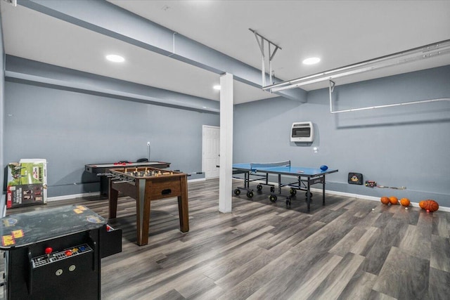 game room with wood finished floors, recessed lighting, baseboards, and heating unit
