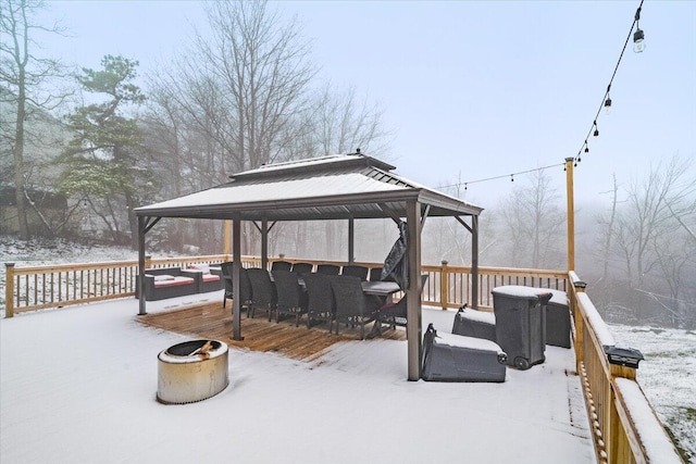 snow covered deck featuring a gazebo