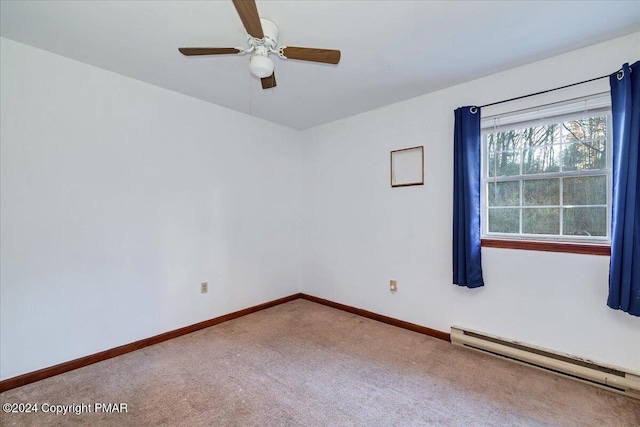 empty room with carpet floors, a baseboard radiator, a ceiling fan, and baseboards