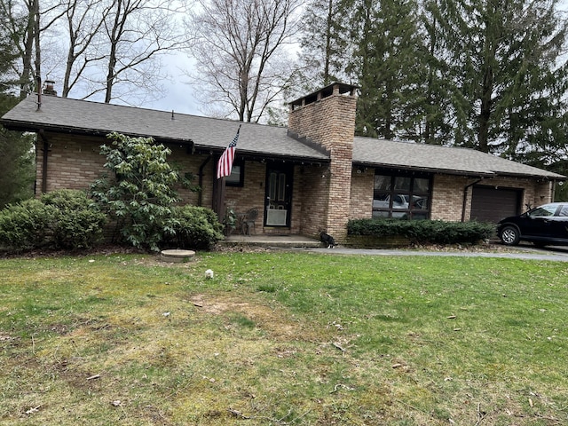 4193 Forest Dr, Kunkletown, PA 18058 - ranch-style home featuring brick siding, a garage, a front lawn, and a chimney