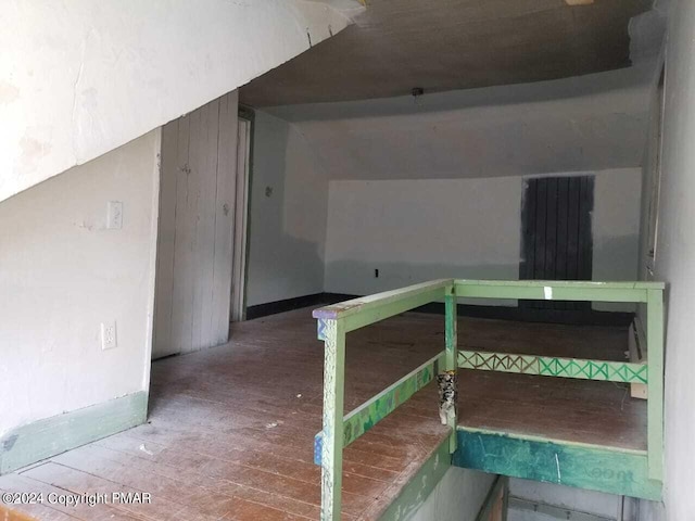 bonus room with wood finished floors