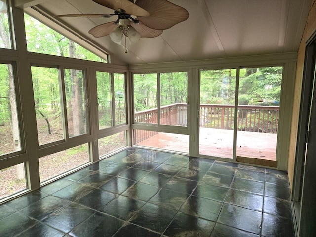 3221 Windermere Dr, Bushkill, PA 18324 - unfurnished sunroom with vaulted ceiling, stone tile floors, and ceiling fan