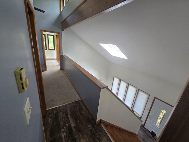 3221 Windermere Dr, Bushkill, PA 18324 - hall featuring a skylight, high vaulted ceiling, and wood finished floors