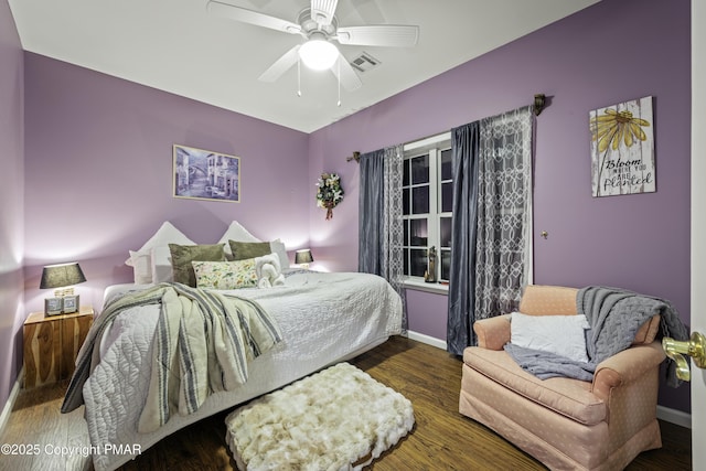 bedroom featuring ceiling fan and dark hardwood / wood-style floors