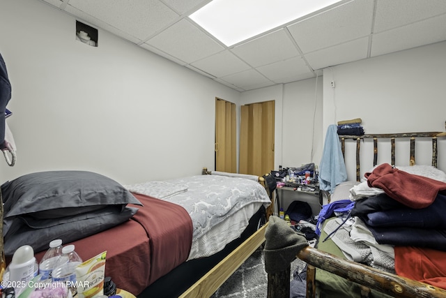 bedroom with a drop ceiling