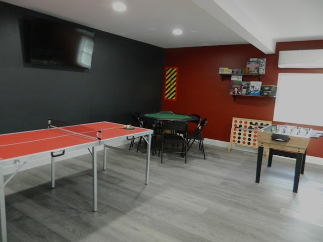 7086 Boulder Ct, Tobyhanna, PA 18466 - game room with a wall mounted air conditioner, wood finished floors, baseboards, recessed lighting, and beam ceiling