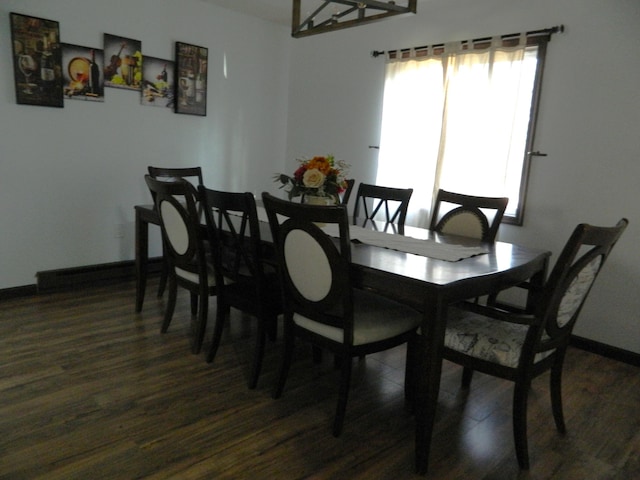 7086 Boulder Ct, Tobyhanna, PA 18466 - dining area featuring dark wood finished floors and baseboards