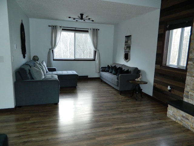 7086 Boulder Ct, Tobyhanna, PA 18466 - living area featuring dark wood-type flooring and a textured ceiling