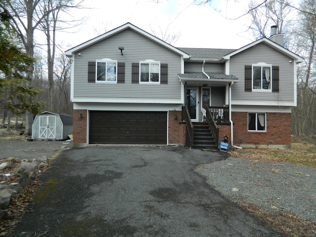 7086 Boulder Ct, Tobyhanna, PA 18466 - raised ranch featuring brick siding, an attached garage, a chimney, and asphalt driveway