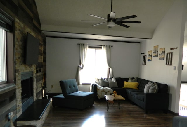 7086 Boulder Ct, Tobyhanna, PA 18466 - living room with a ceiling fan, dark wood-style flooring, healthy amount of natural light, a fireplace, and lofted ceiling
