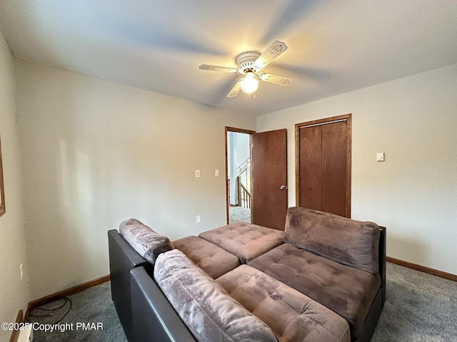 living room featuring carpet floors and ceiling fan