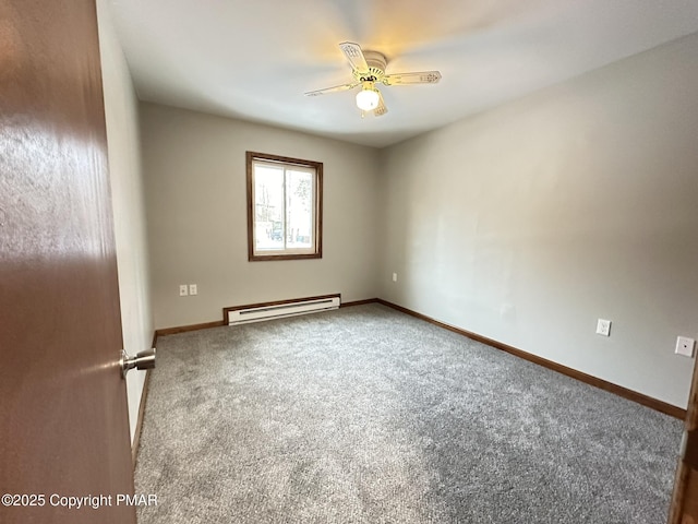 spare room with ceiling fan, carpet floors, and baseboard heating