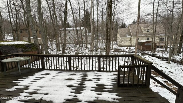 view of snow covered deck